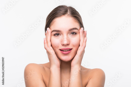 Beautiful sensual woman touching her face isolated on white background. Beauty and skincare concept. Spa.