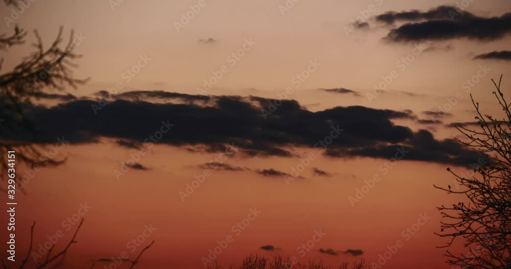 Tilting up Time-lapse Evening Clouds above House and Trees in the Village. Countryside Tilting up Time-lapse Evening Clouds above House and Trees in the Village. Countryside