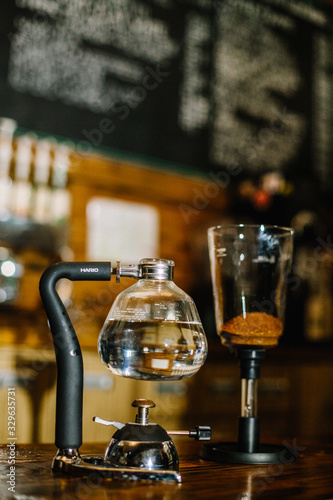Siphon vacuum coffee maker on cafe bar