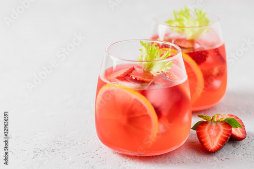 Summer iced strawberry lemon infused water cocktail. Selective focus, space for text.