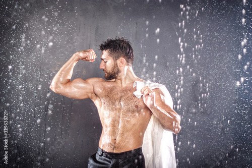 Photography Strong athletic bearded sexy hot young man posing in black trousers and white sh