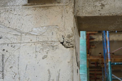 The hole or gap on the surface of the concrete post is caused by uneven cement. Problems that are most common in building construction © Montree