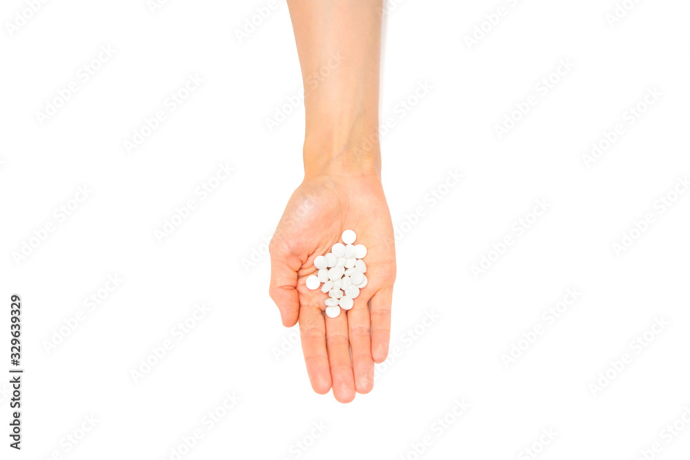 handful of tablets and pills in hand isolated on white handful of tablets and pills in hand isolated on white