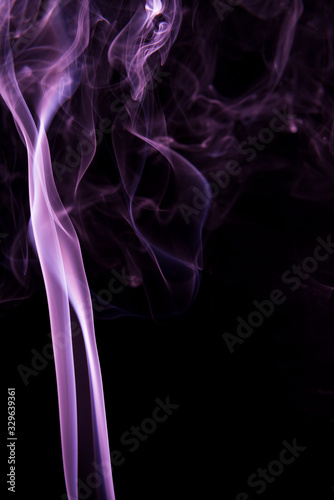 Violet smoke on black background