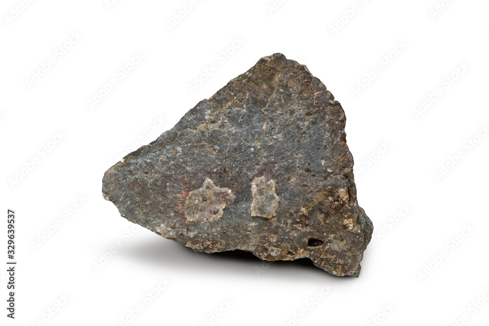Basalt stone isolated on white background. Basalt is a mafic extrusive rock, igneous rock. Basalt stone isolated on white background. Basalt is a mafic extrusive rock, igneous rock.