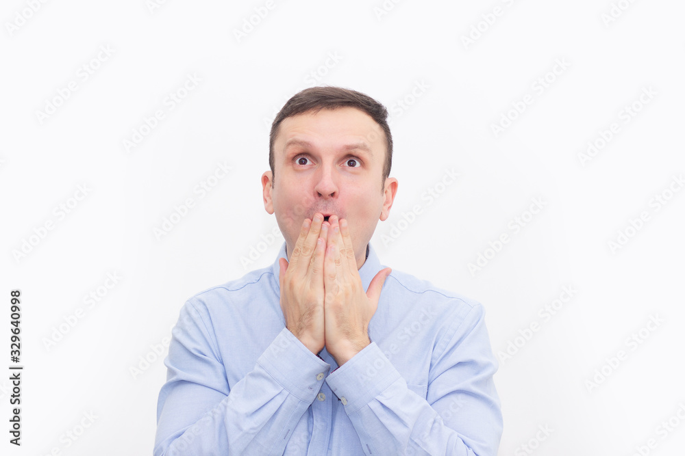 The surprised man. Close up. Bright emotions on the face. The Concept Omg The surprised man. Close up. Bright emotions on the face. The Concept Omg