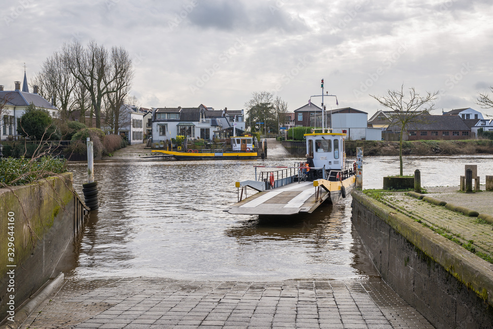 Ferry in the river Hollandsche IJssel for transfers between the towns of Moordrecht and Gouderak, Netherlands Ferry in the river Hollandsche IJssel for transfers between the towns of Moordrecht and Gouderak, Netherlands