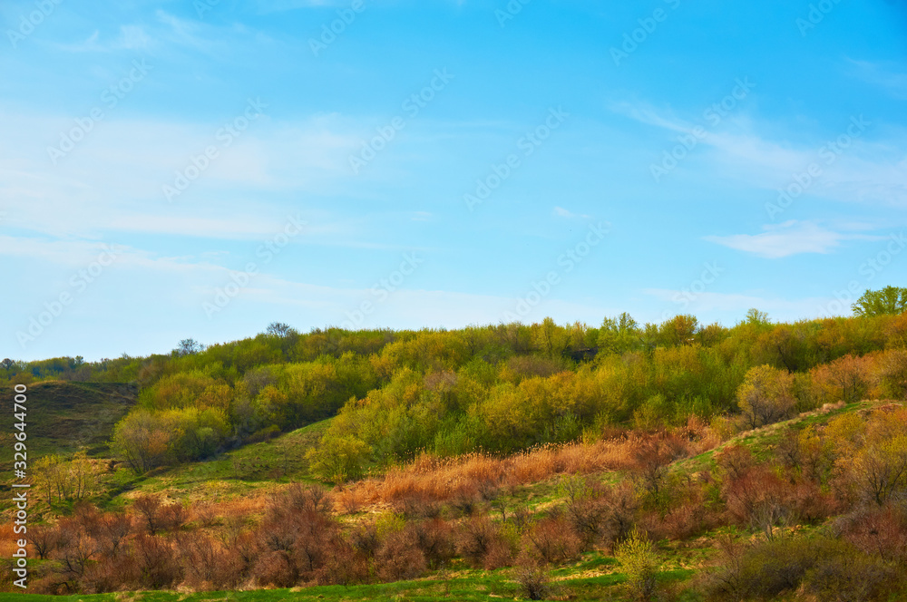 Mountain sea shore in the fall against the blue sky with clouds. Mountain sea shore in the fall against the blue sky with clouds.