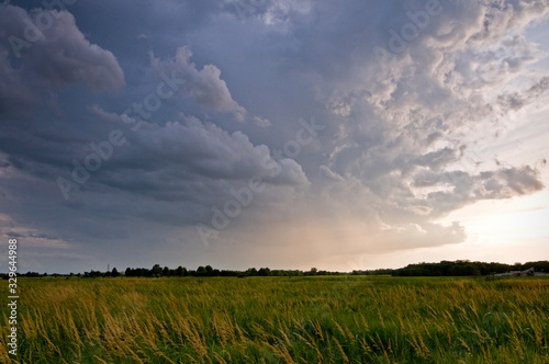 Принти на полотні Building storm clouds over a Midwest prairie on a summer afternoon