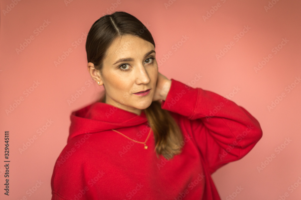 young woman in a bright red hoodie young woman in a bright red hoodie