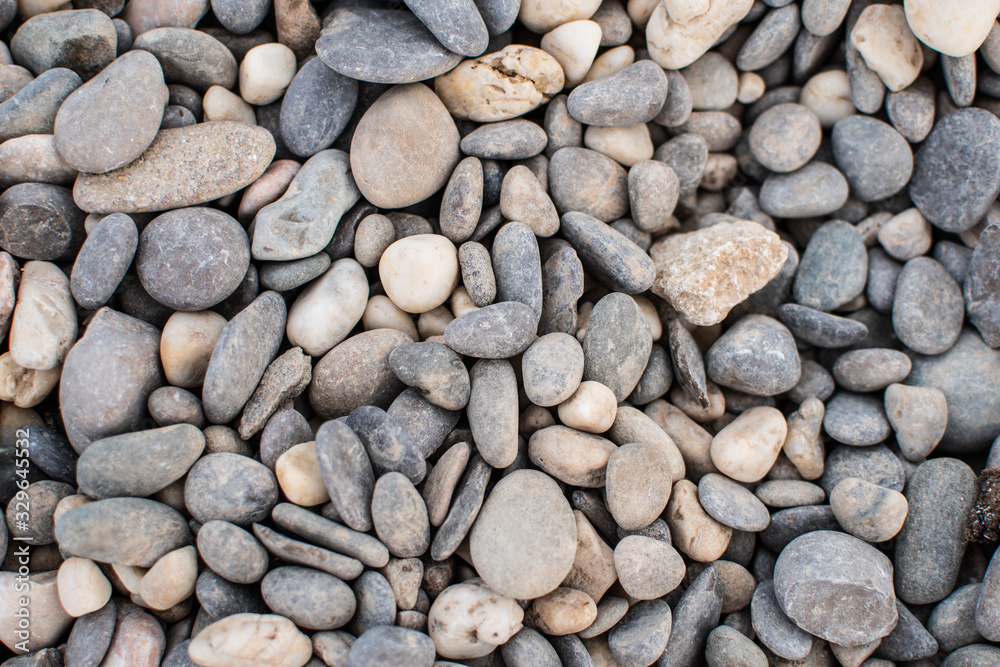 Sea pebbles. Background of pebbles. Wet stones. Multicolored pebbles. Sea shore. Sea pebbles. Background of pebbles. Wet stones. Multicolored pebbles. Sea shore.