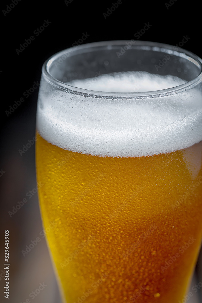 Light beer in a glass on the table Light beer in a glass on the table