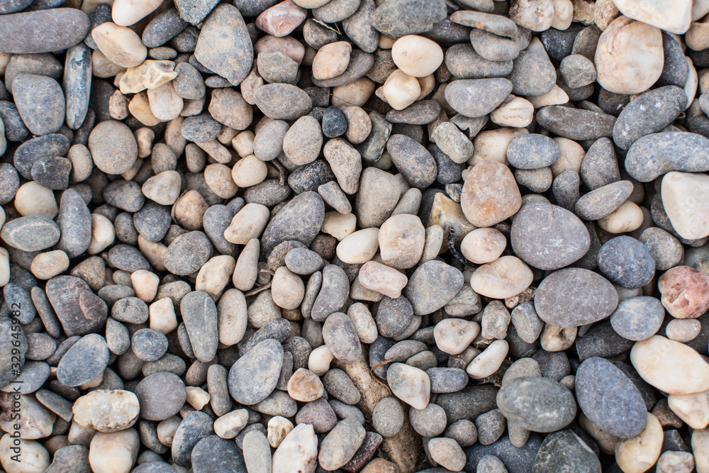 Sea pebbles. Background of pebbles. Wet stones. Multicolored pebbles. Sea shore. Sea pebbles. Background of pebbles. Wet stones. Multicolored pebbles. Sea shore.