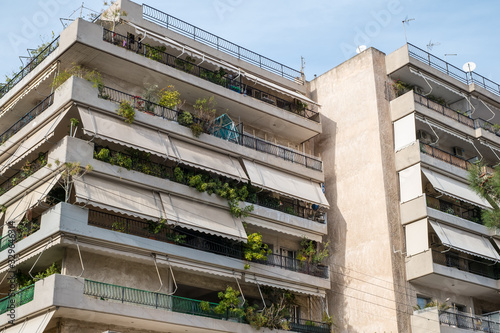Fototapeta Naklejka Na Ścianę i Meble -  on the streets of Athens with blocks of flats and shops, Greece