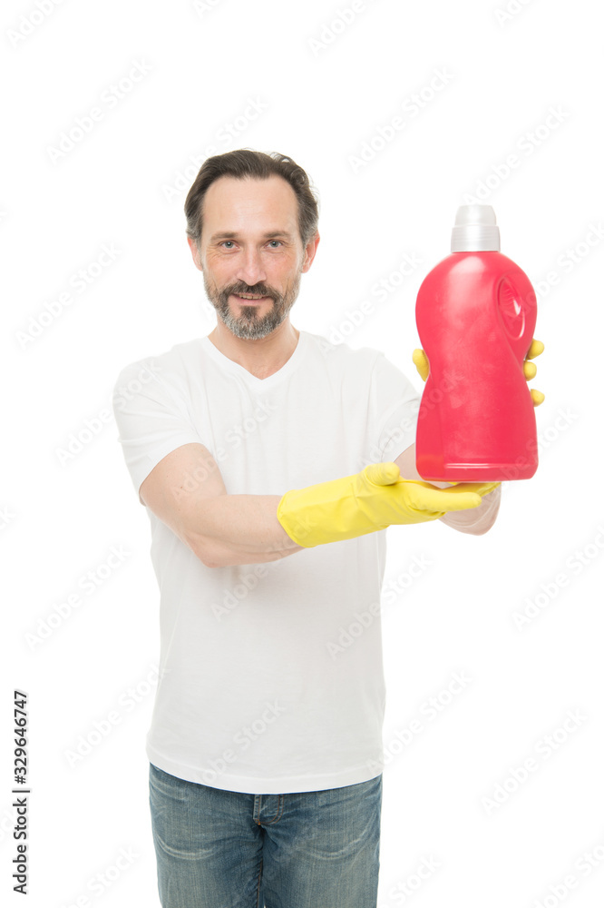 Doing laundry. Product for cleaning. Man rubber gloves hold plastic bottle liquid soap chemical cleaning agent. Bearded mature guy cleaning home. Cleanup concept. The key to cleanliness in house