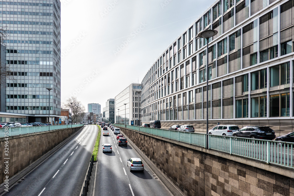 Fototapeta premium Modern Urban Cityscape with Buildings, Road and Cars