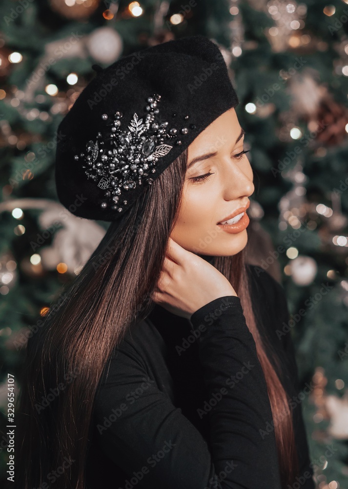 Portrait of beautiful young brunette woman with makeup in hat Portrait of beautiful young brunette woman with makeup in hat