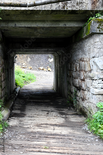 Fototapeta Naklejka Na Ścianę i Meble -  Stone dark tunnel with Light to the End
