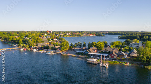 Beautiful aerial view photo from drone on Trakai city, located near Galve lake in Lithuania. Surrounded by beautiful lakes and green islands with plenty of water attractions for tourists available. (s