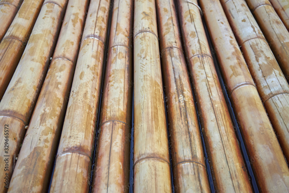 Bottom of a bamboo raft in water as a background or backdrop