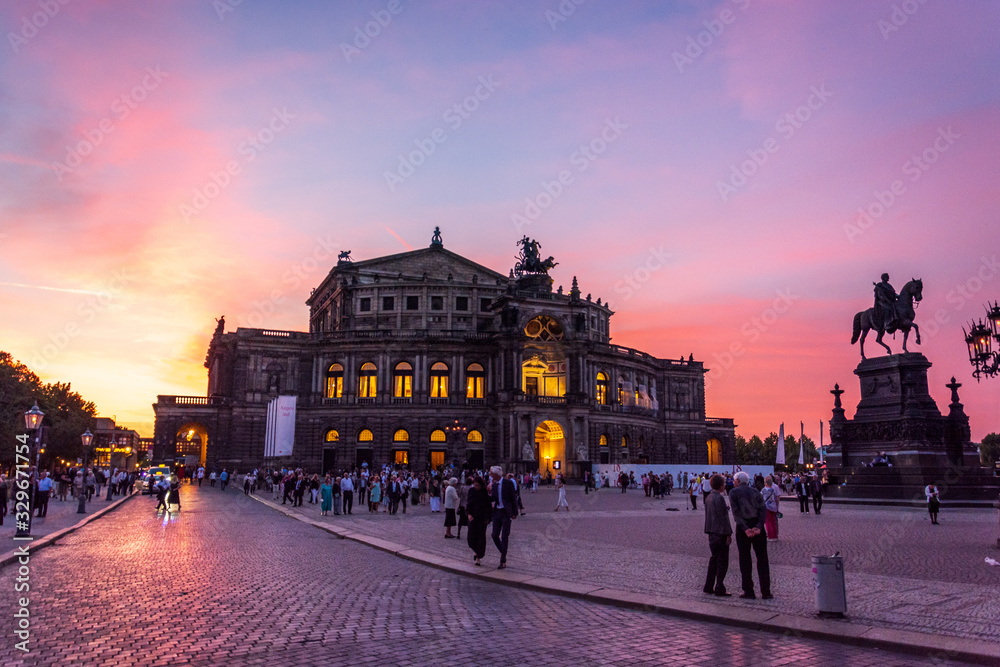 Fototapeta premium DRESDEN, GERMANY - June 15, 2019: Famous opera house Semperoper in Dresden after a concert after sunset