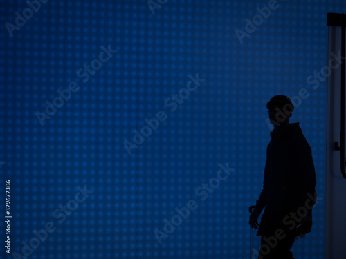 silhouette of a man on blue background