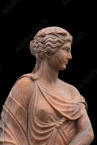 Clay head of an ancient Greek goddess isolated on black background
