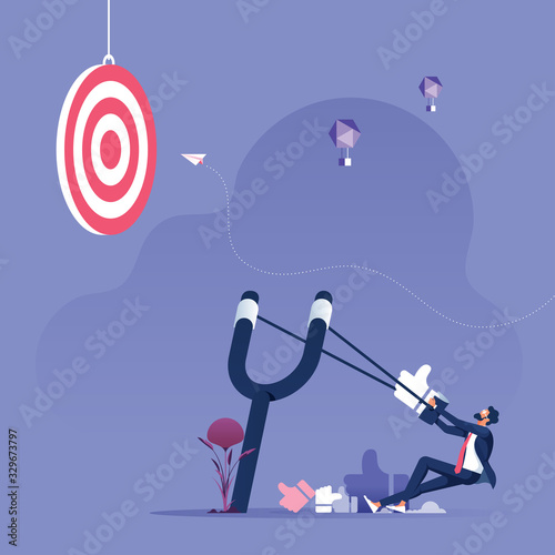 Businessman aiming like icon with a slingshot to target-Social media marketing concept