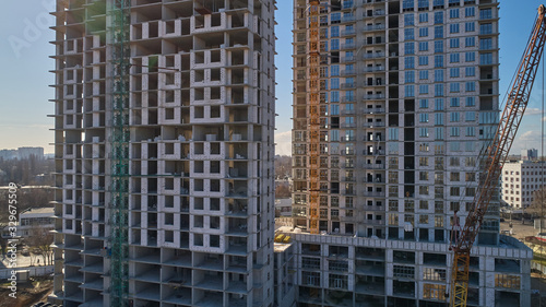 Construction of high-rise residential building. Aerial view of construction of high-rise apartment building.