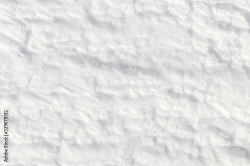 Fresh snow background - packed, wind blown, pattern close-up