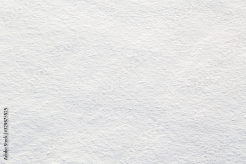 Fresh snow background - close-up of clean, rough snow texture