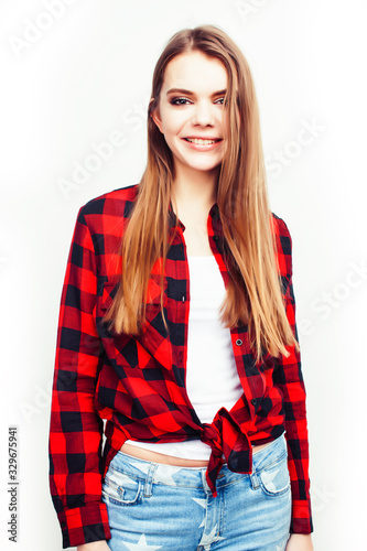 young pretty teenage hipster girl posing emotional happy smiling on white background, lifestyle people concept