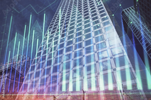 Forex chart on cityscape with tall buildings background multi exposure. Financial research concept.