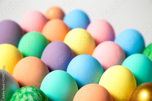 Many colorful easter eggs on white background