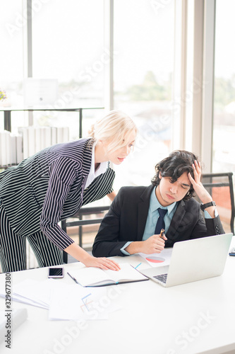 Business people are analyzing financial report