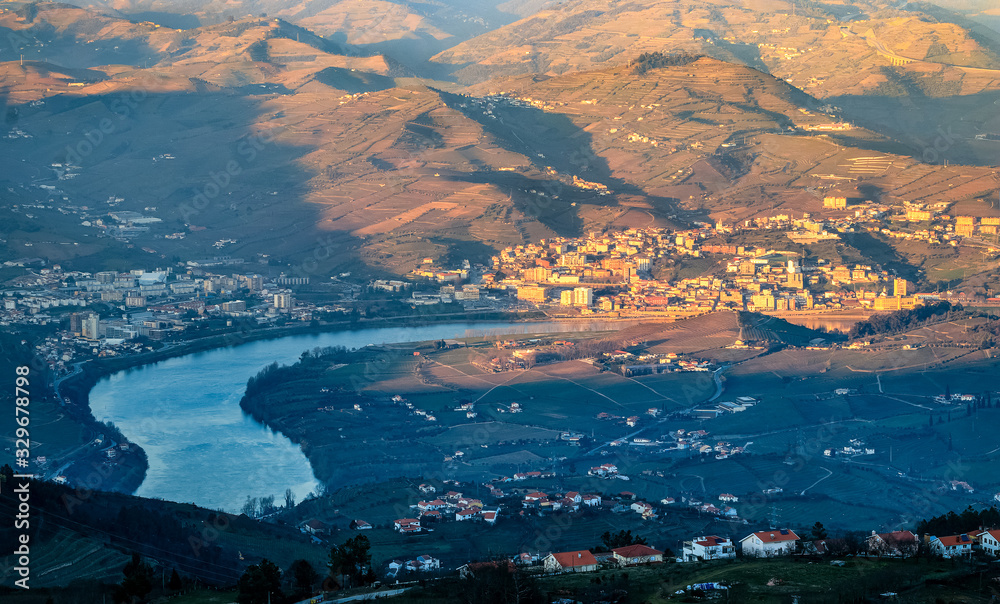 City of Peso da Régua and the Douro River, seen from the Boa Vista viewpoint near Lamego, in Portugal, on a late winter afternoon.