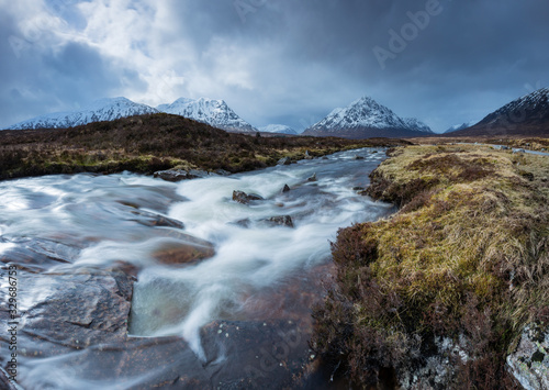 the river coupall waterfalls on rannoch moor showing buachaille etive mor in the background as the entrance to glencoe valley in winter photo