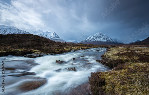 the river coupall waterfalls on rannoch moor showing buachaille etive mor in the background as the entrance to glencoe valley in winter photo