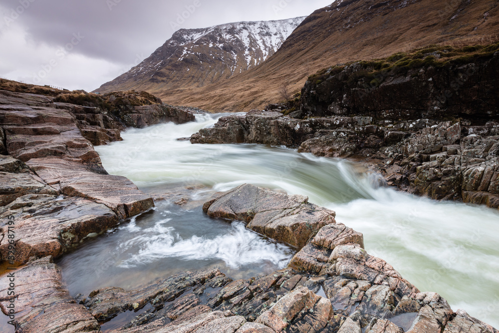 the river coupall waterfalls on rannoch moor showing buachaille etive mor in the background as the entrance to glencoe valley in winter the river coupall waterfalls on rannoch moor showing buachaille etive mor in the background as the entrance to glencoe valley in winter