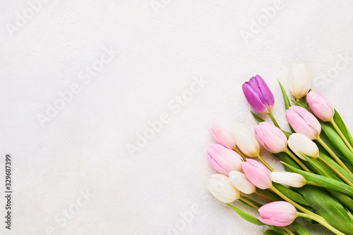 Bouquet of pink and white tulips on light background. Mothers day, Valentines Day, Birthday celebration concept. Copy space, top view