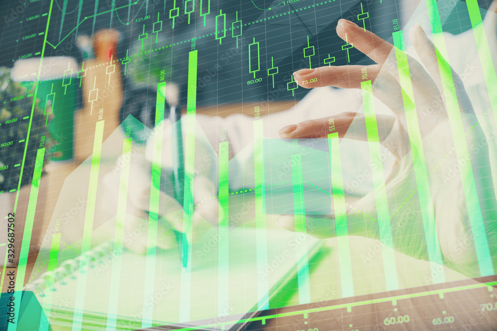 Forex chart displayed on woman's hand taking notes background. Concept of research. Multi exposure Forex chart displayed on woman's hand taking notes background. Concept of research. Multi exposure