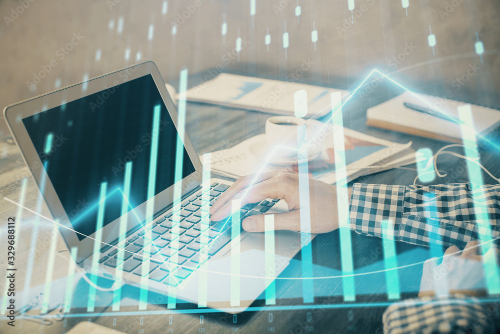 Obraz premium Double exposure of forex chart with man working on computer on background. Concept of market analysis.
