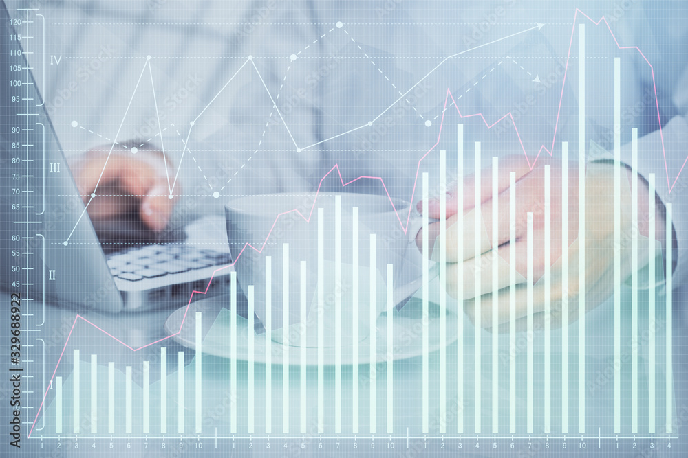 Double exposure of graph with man typing on computer in office on background. Concept of hard work. Double exposure of graph with man typing on computer in office on background. Concept of hard work.