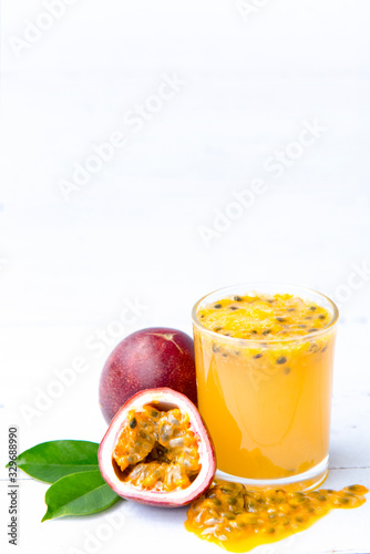 fresh passion fruit  juice smoothies isolated on white wooden background  Healthy drink concept  Selective focus  Copy space.