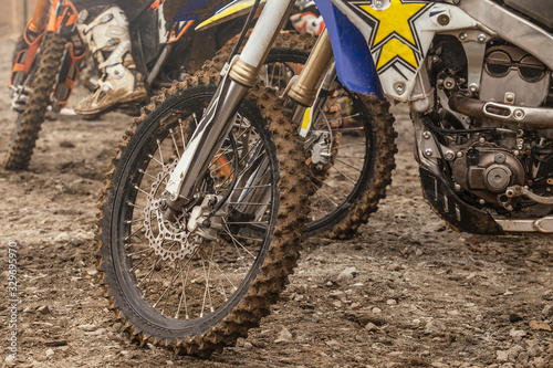 Close-up of the wheel of a racing cross-country motorcycle after the race. Lifestyle. Moto sport.