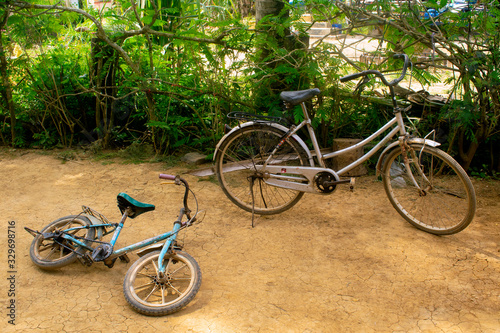 Phumĭ O Srâlau Cambodia - Old Bikes on dirt. © VANNRA
