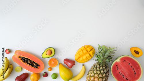 Fototapeta Naklejka Na Ścianę i Meble -  Top view of assortment of exotic fruits and copy space on white background