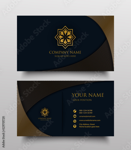 business card with gold floral logo and place for text on dark blue background