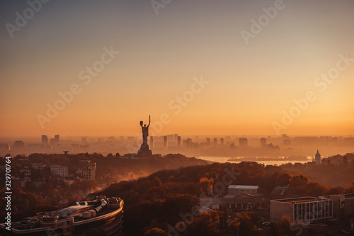 Mother Motherland monument at sunset. In Kiev, Ukraine. photo