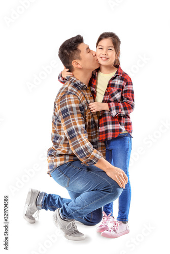 Happy Asian man kissing his...
